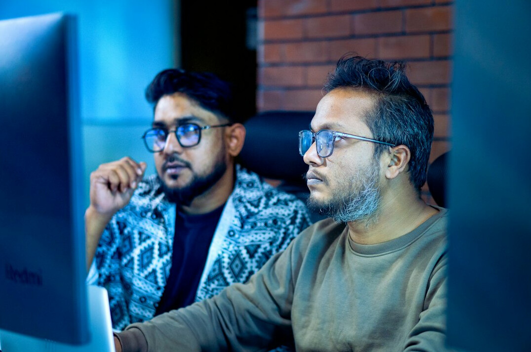team collaborating on computer